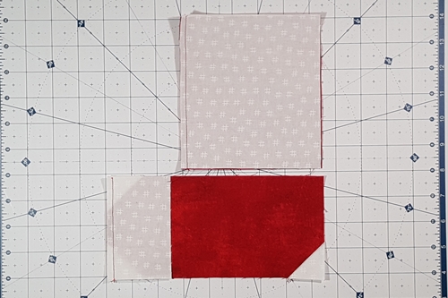 Step 2 Christmas Stocking Quilt Block Pattern: Stitch side panel (E) to left side of rectangle (J). Stitch side panel (C) to the left side of rectangle (I).