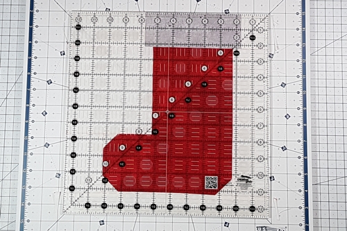 Step 7 Christmas Stocking Quilt Block Pattern: Trim the block to size.